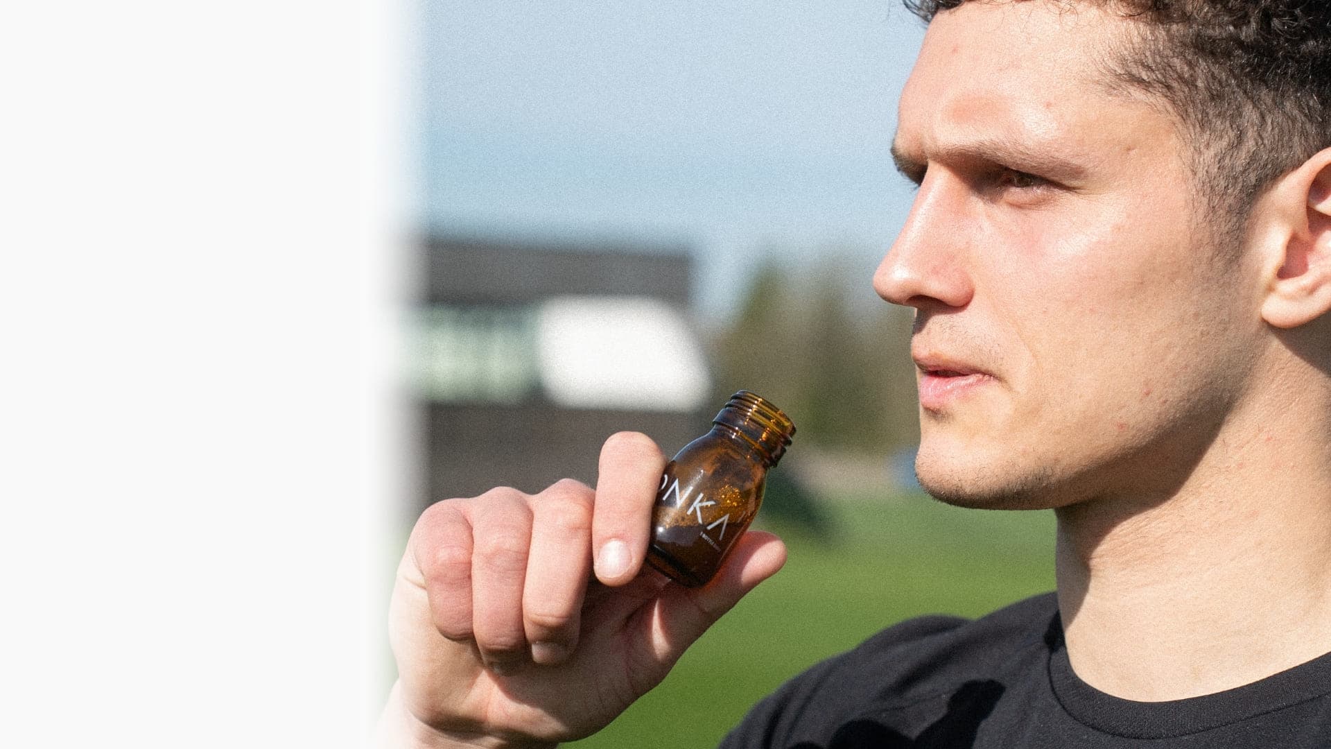 Person with CONKA bottle outdoors