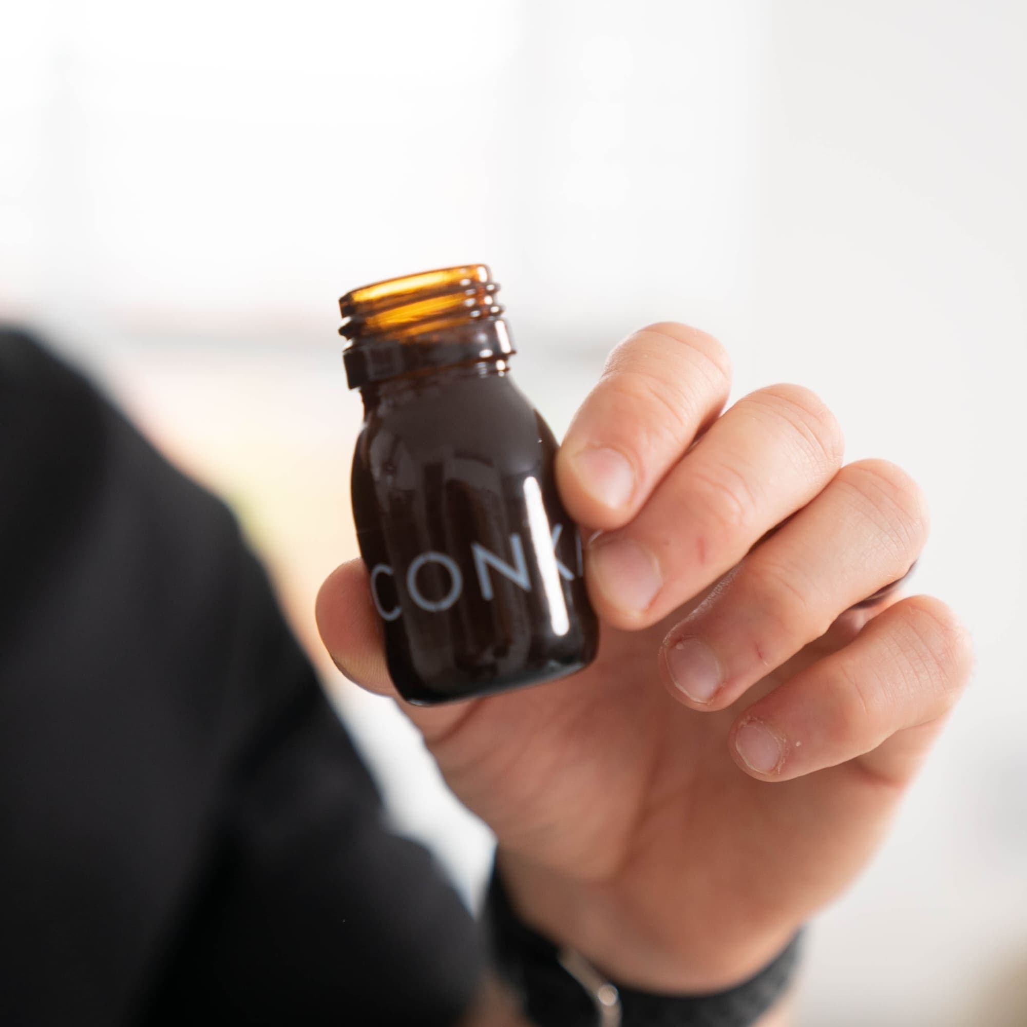 Holding CONKA bottle