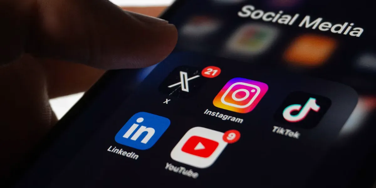 A phone screen of social media apps showing unread notification badges
