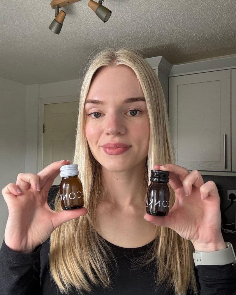 A CONKA customer holding the daily shots