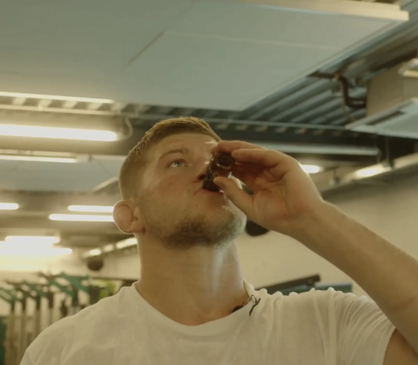 A professional athlete taking a CONKA shot in a gym