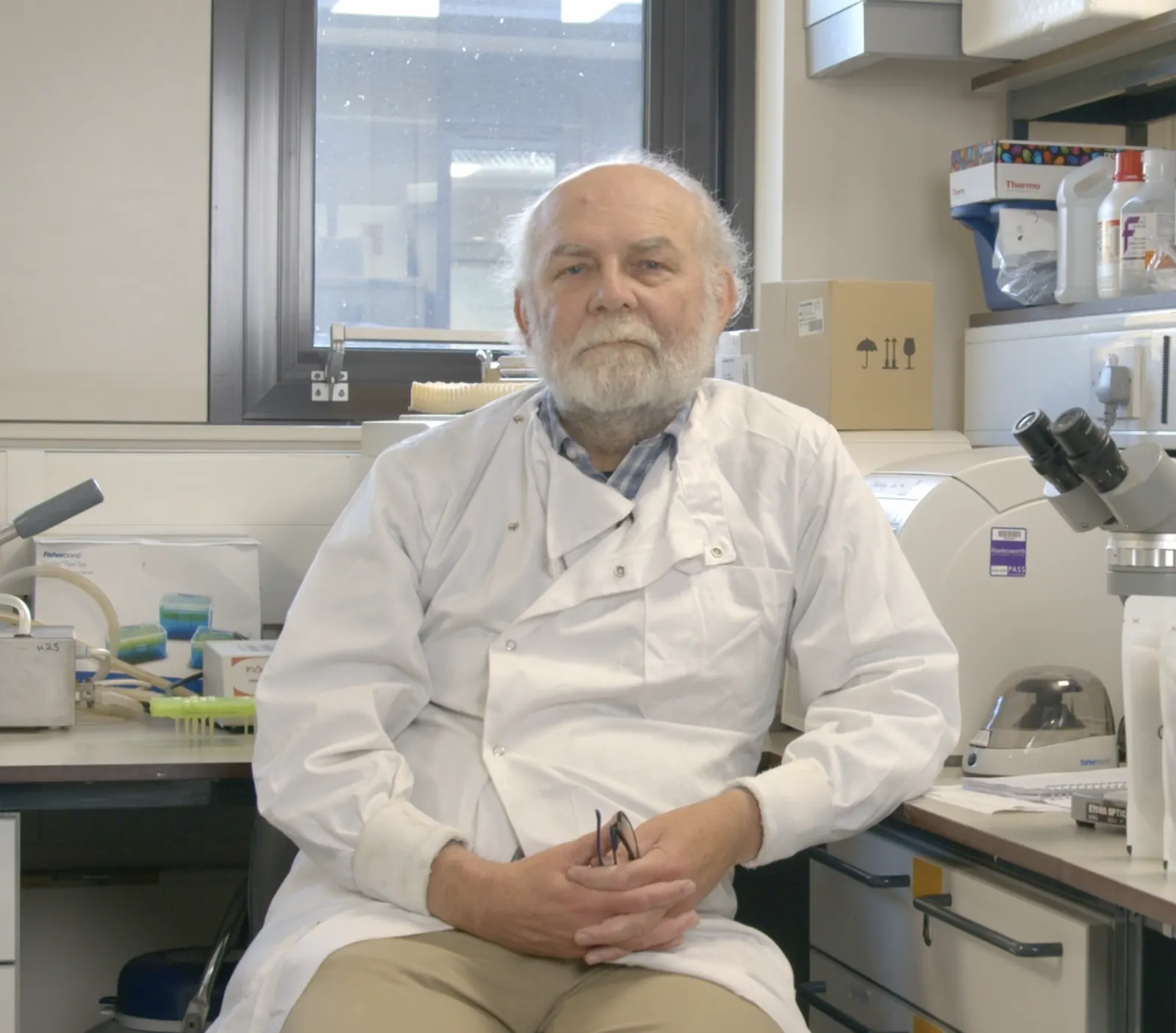 A neuroscientist in a white coat in a Durham University laboratory