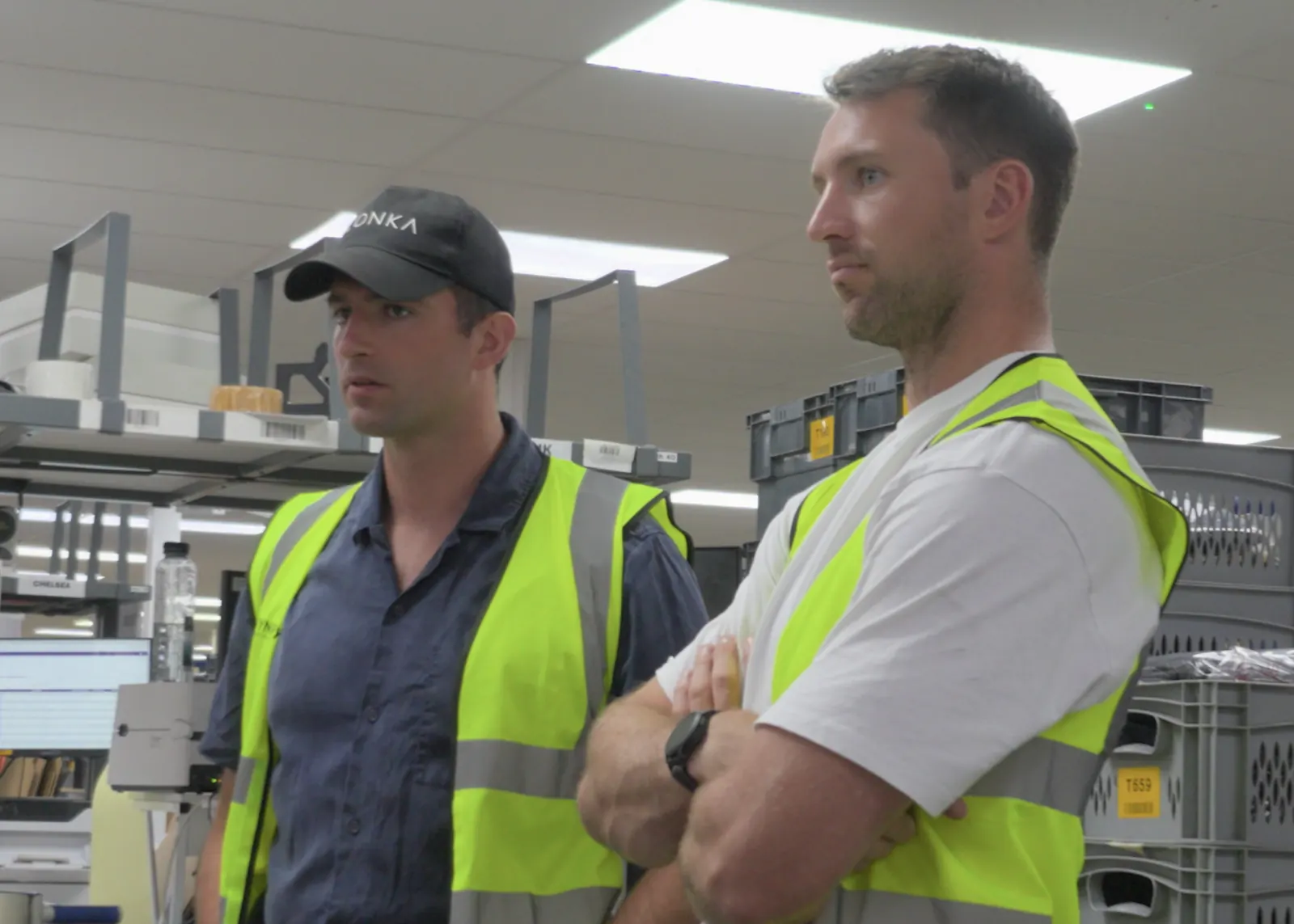 CONKA founders Harry Glover and Humphrey Bodington on site in high-visibility vests